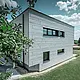Seitenansicht eines modernen Einfamilienhauses mit Blick auf die Siding.X Fassade.