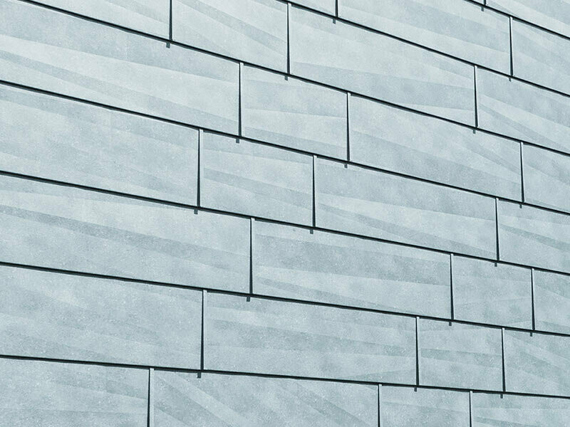 Fassadenpaneel FX.12 mit den charakteristischen Kantungen, P.10 steingrau